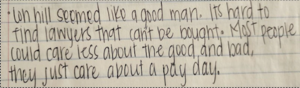 Figure 6. Image description: a photograph of four lines of notes written in black ink on a sheet of notebook paper 