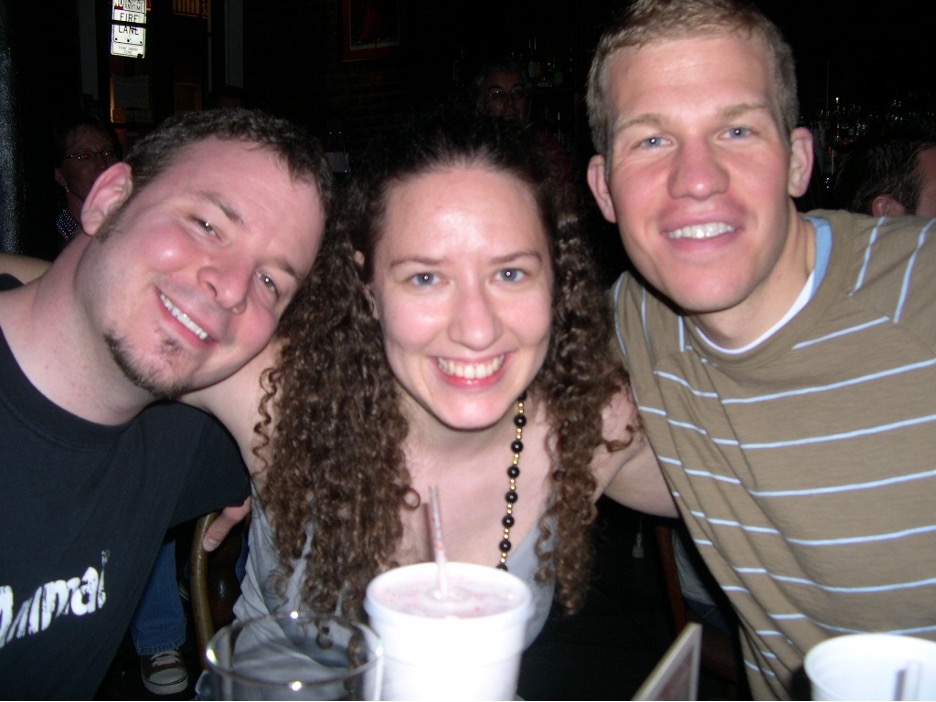 Figure 4: Young Jennifer with arms around Dan and Brian wearing Mardi Gras beads