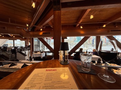 Figure 5: Restaurant menu on table with wooden scaffolding and window